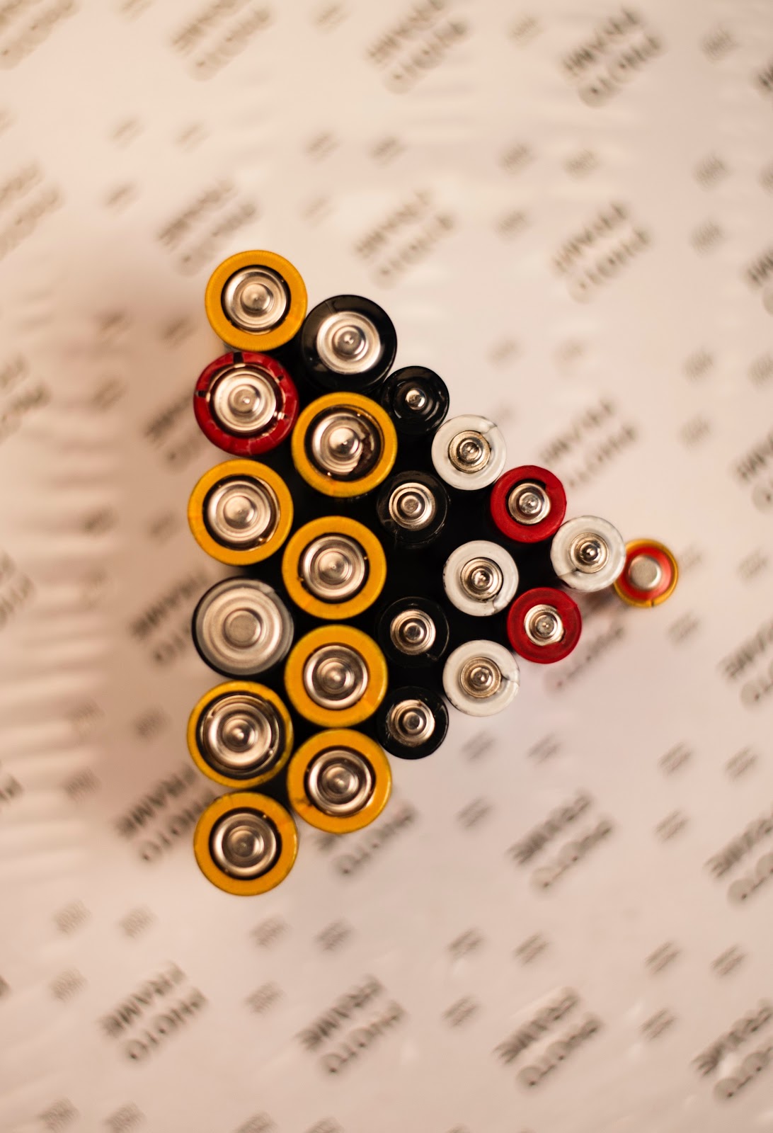 group of batteries on a table.